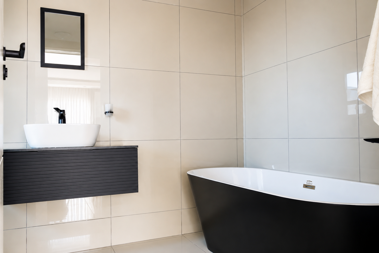 Bathroom vanity with vessel basin beside the freestanding tub