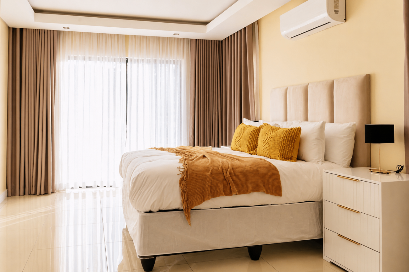 Bright bedroom with king bed and warm light